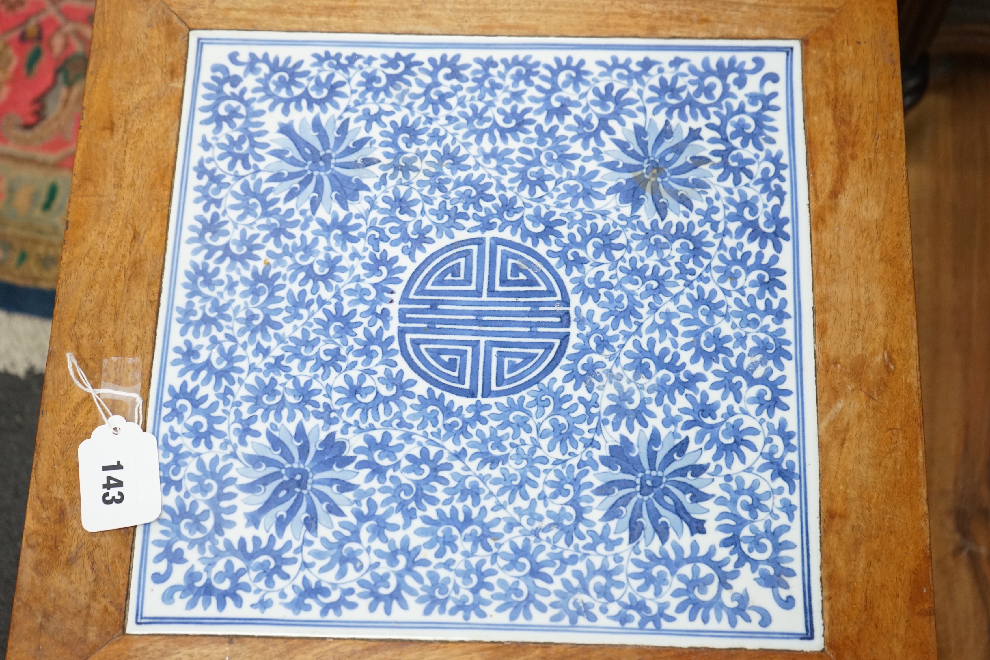 A Chinese hardwood and underglaze blue porcelain tile inset table, width 42cm, depth 42cm, height 43cm